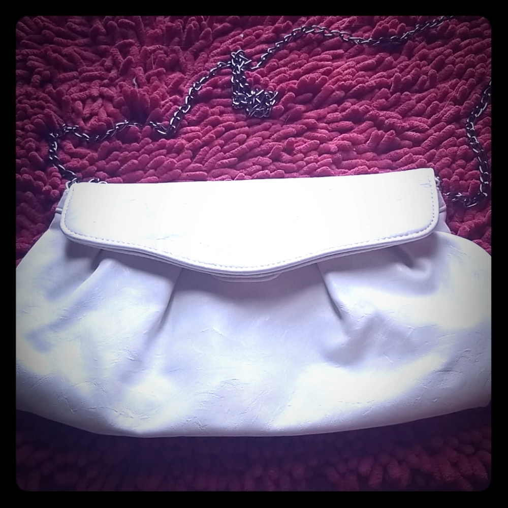 Super cute white bag .